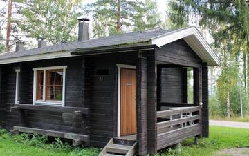 Фото номера Коттедж с 2 спальнями и сауной Дома для отпуска Riihivuori Cottages г. Муураме 68